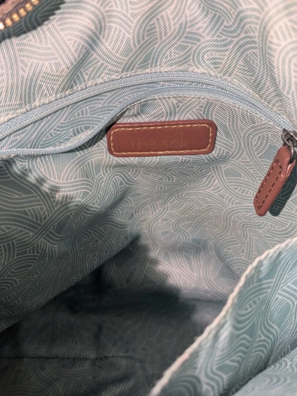 The Sak Pebbled Leather Crossbody Bag in Taupe Gray